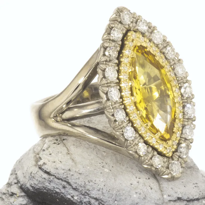 Yellow sapphire ring in white gold with a double halo of diamonds